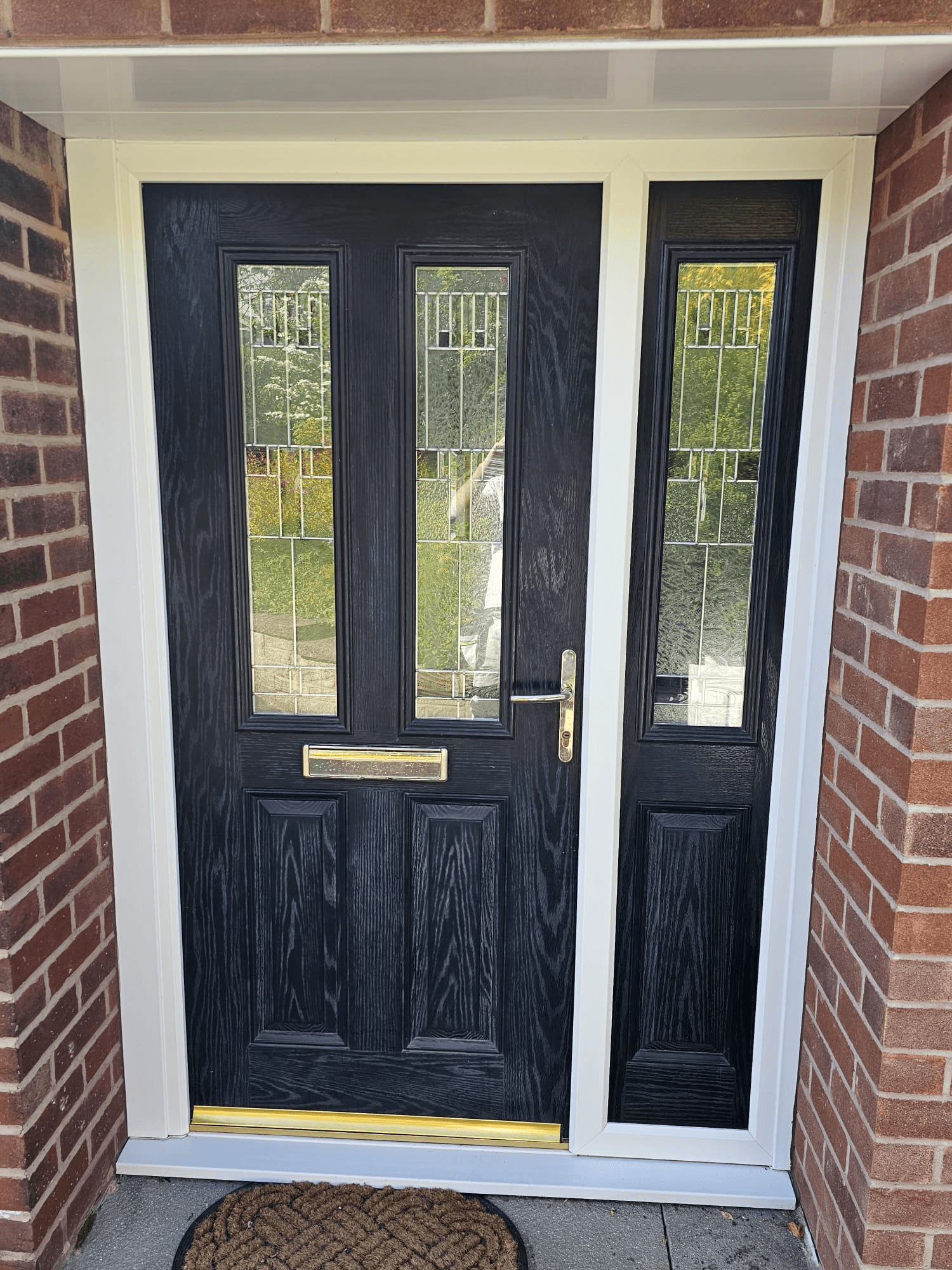 Composite door spraying Sheffield — jet black finish with decorative glass side panel