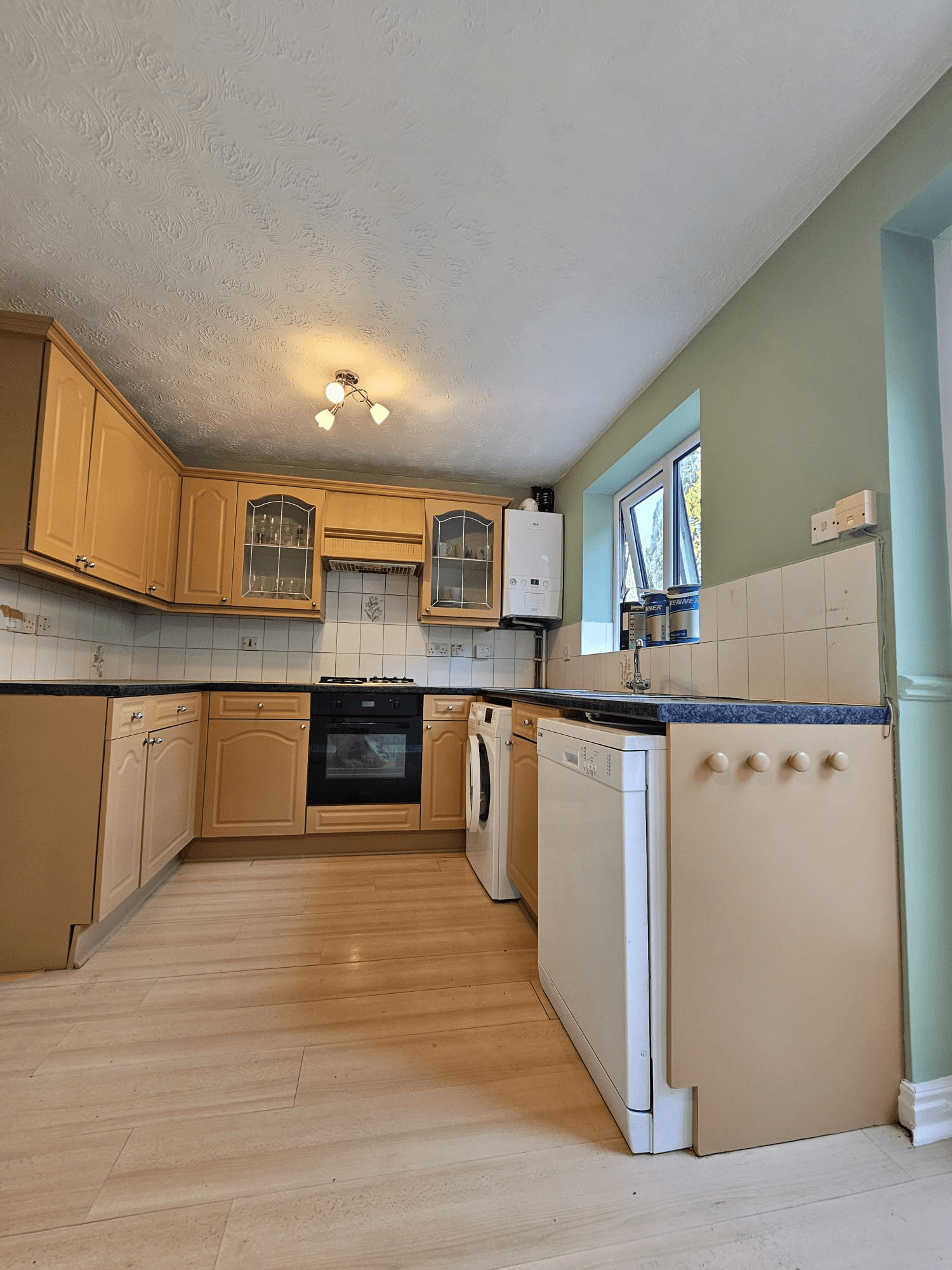 Kitchen before respray Sheffield — beige kitchen cabinets before colour change