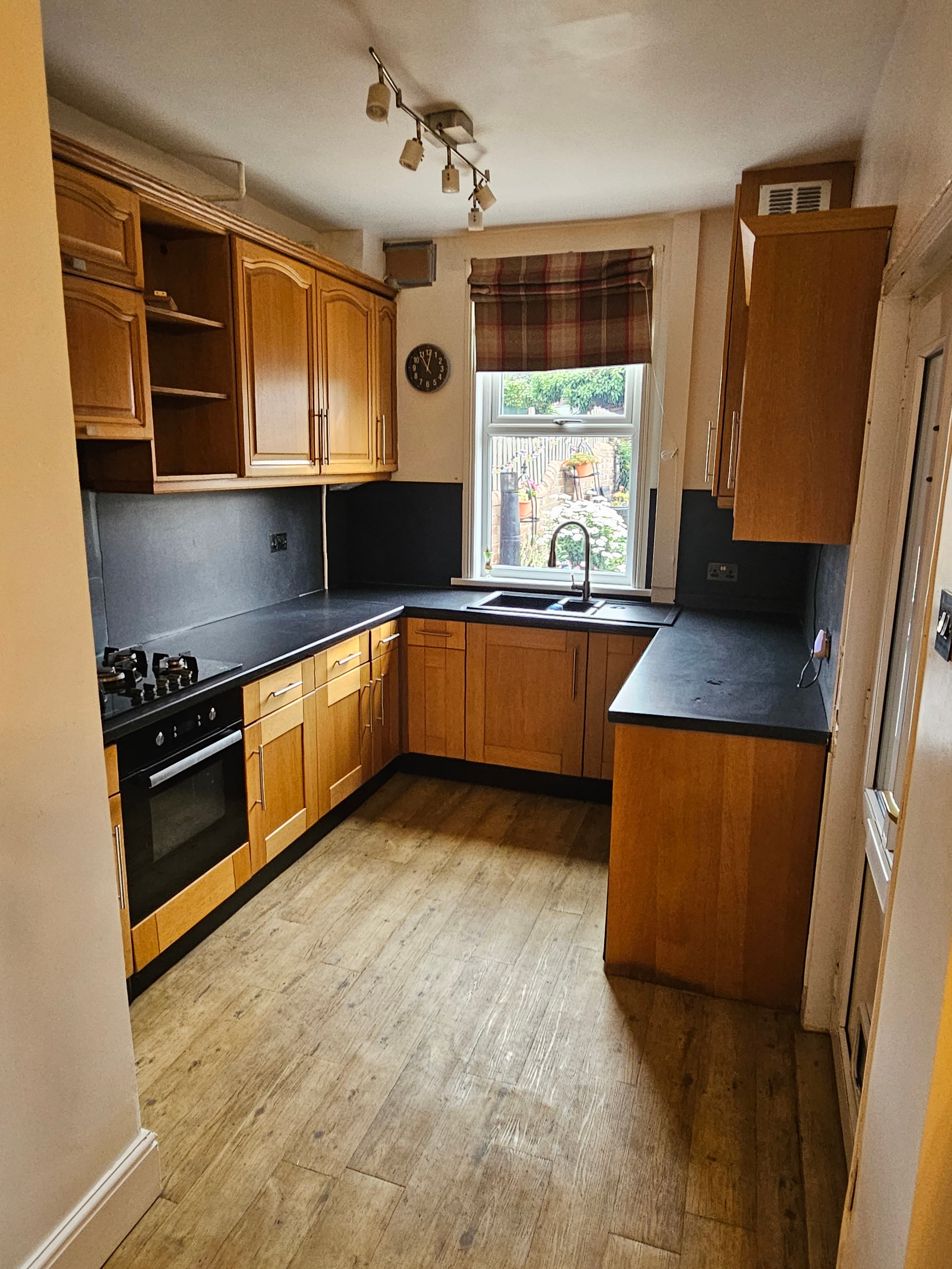 Kitchen before respray Sheffield — full oak cabinet run before colour change