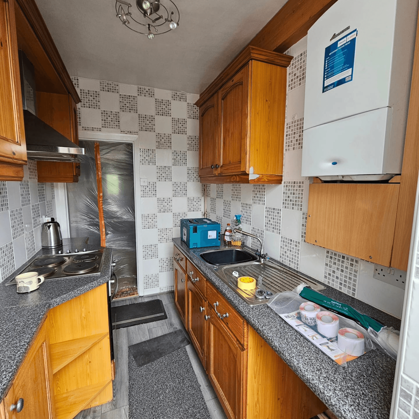 Kitchen before respray Sheffield — oak galley kitchen with mosaic tile splashback