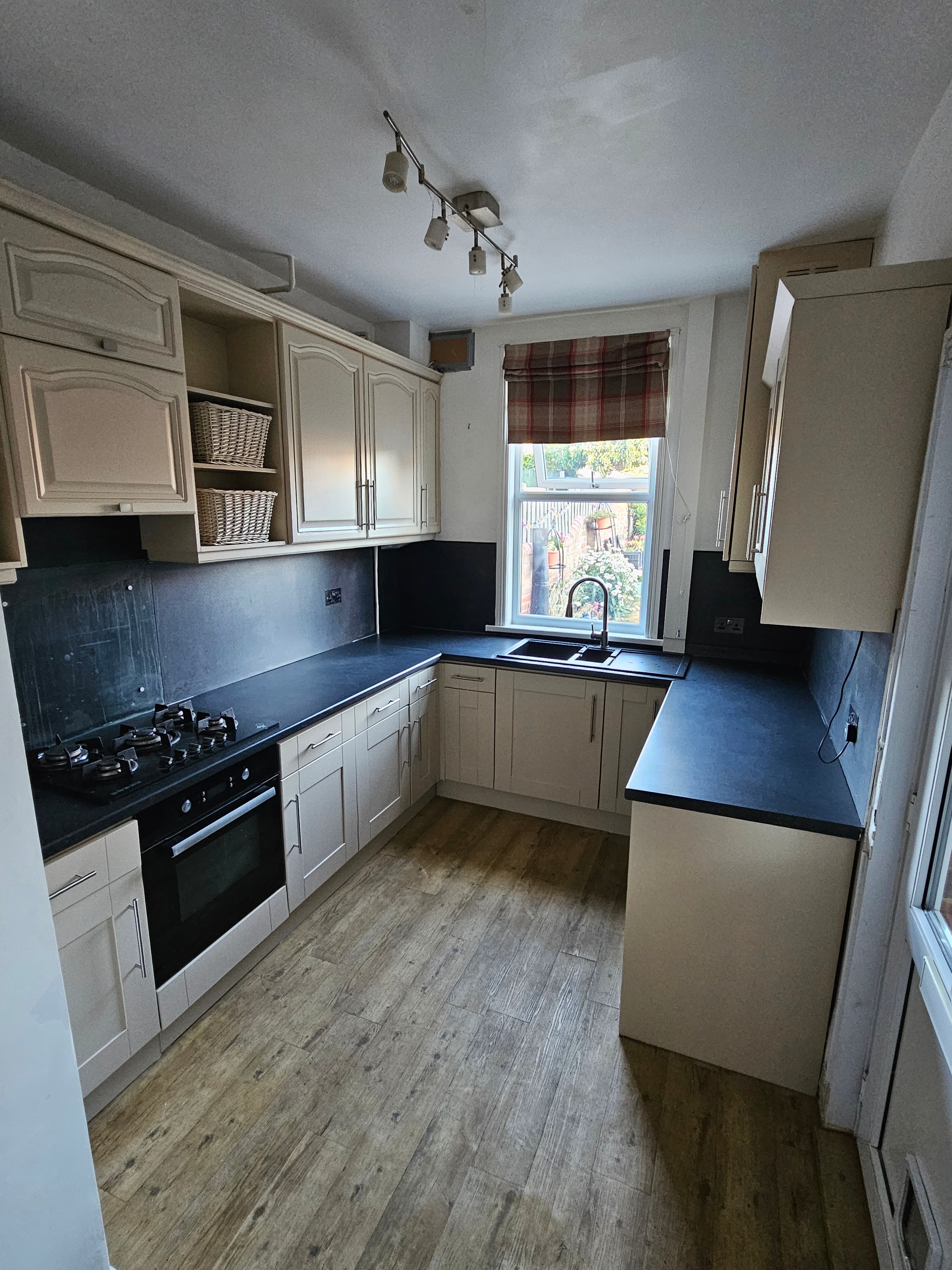 Kitchen respray Sheffield — completed cream kitchen, full cabinet run