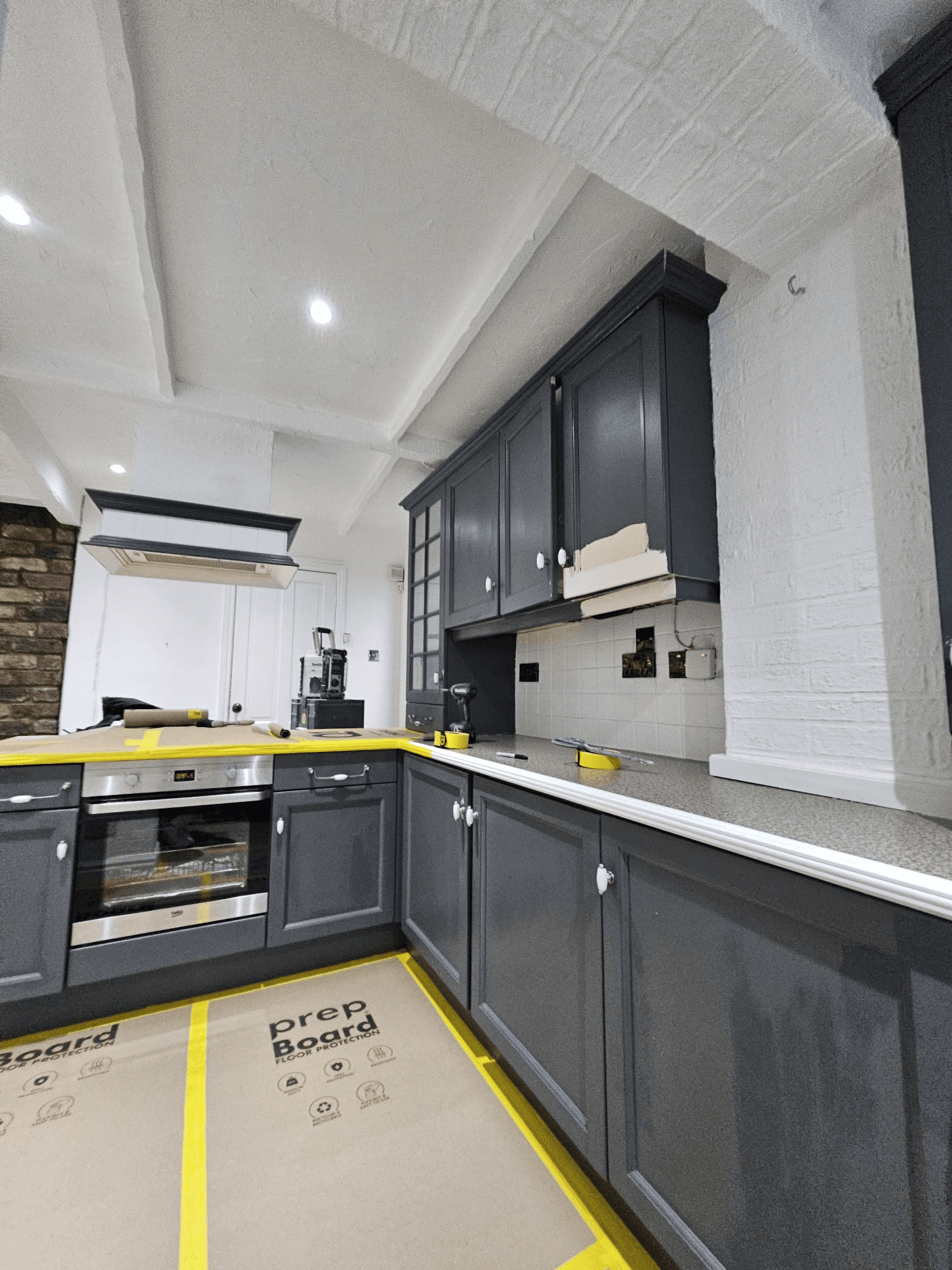 Kitchen spraying Sheffield — dark grey cabinet respray in progress