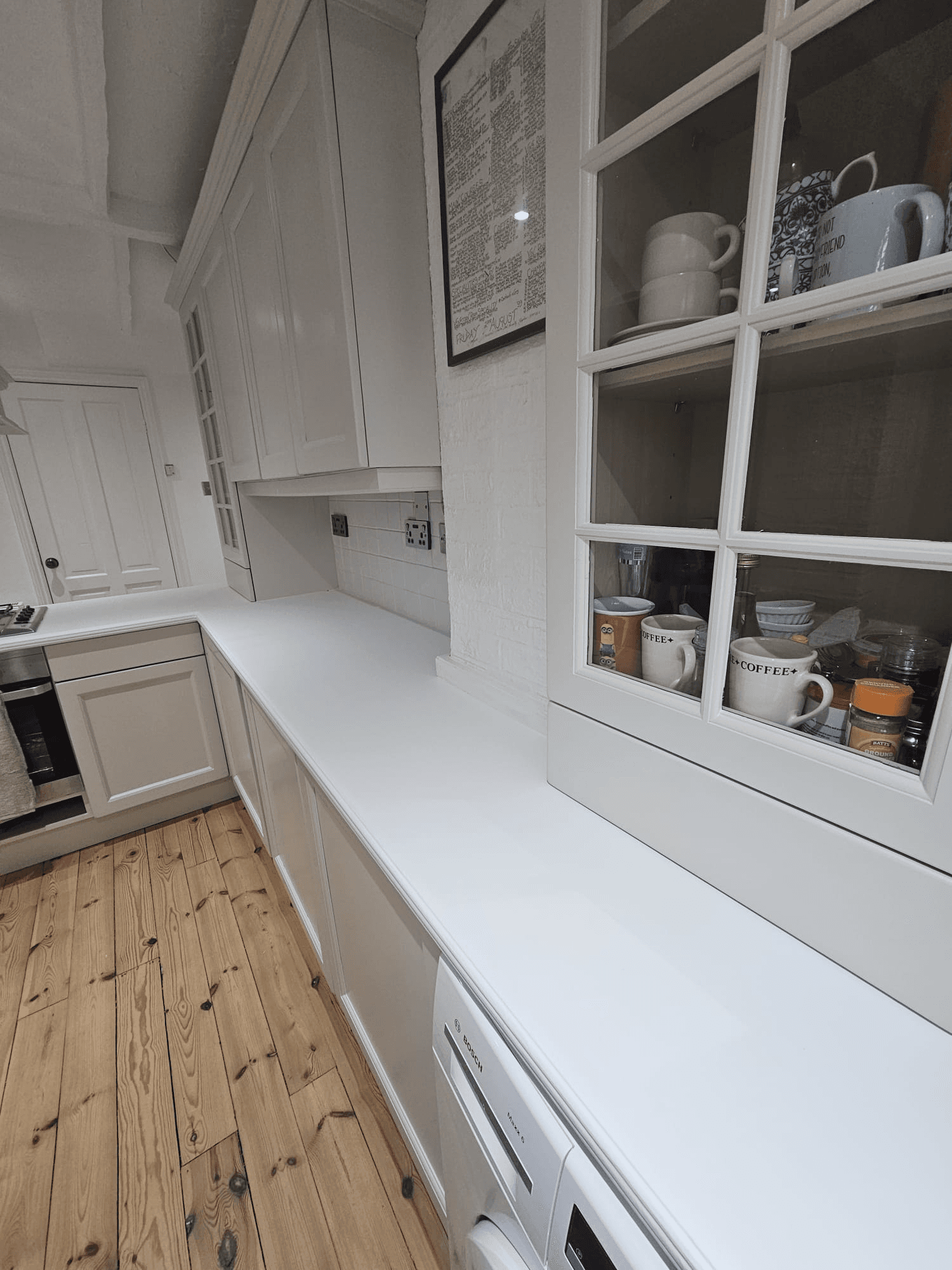 Kitchen respray Sheffield — white wall cabinets and worktop spray finish