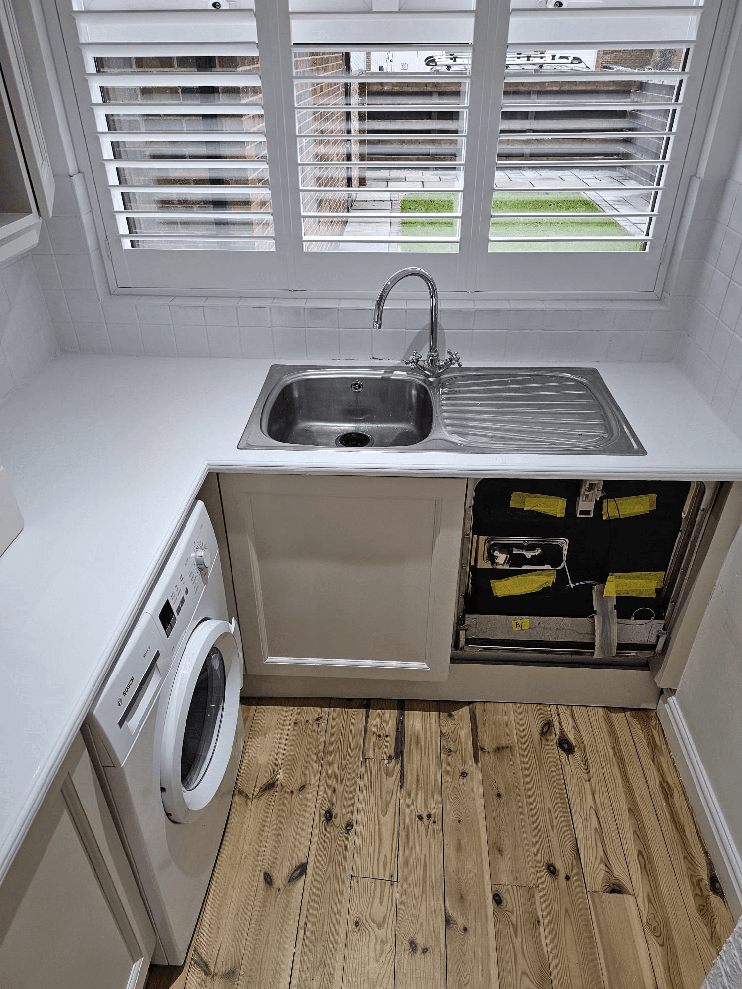 Kitchen worktop respray Sheffield — white sink area and worktop