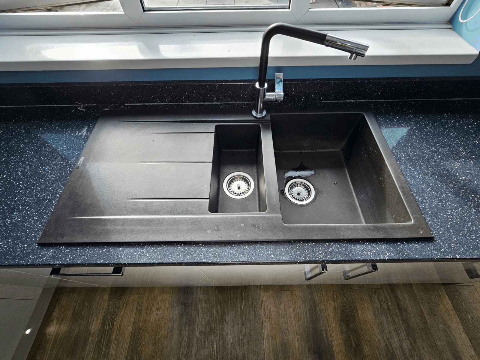 Kitchen worktop respray Sheffield — black galaxy granite sink detail